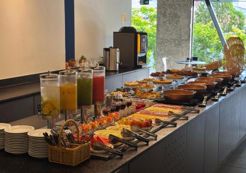 a buffet line with many different types of food at Nord One in João Pessoa