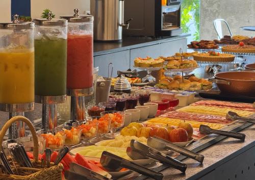 a buffet filled with different types of fruits and vegetables at Nord One in João Pessoa