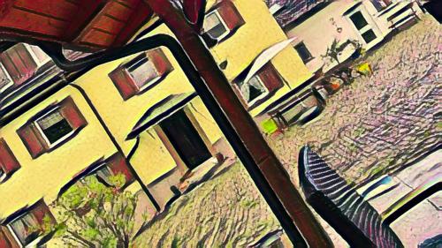 a reflection of a yellow building in a car mirror at HofamHohlebach in Neuenburg am Rhein