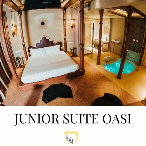 a hotel room with a bed and a jumbo suite oasis at Emotional Grand Motel in Fontaneto dʼAgogna