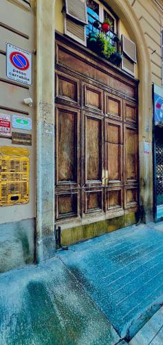 a large wooden door on the side of a building at B&B Da Lisa in Turin