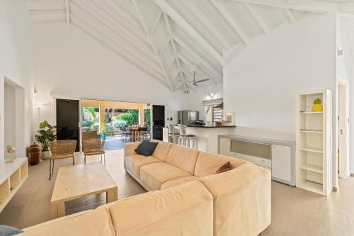 a living room with a couch and a table at Villa Rubio in Grote Berg