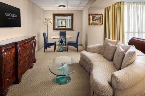 a living room with a couch and a glass table at Eldorado Reno, A Caesars Destination in Reno