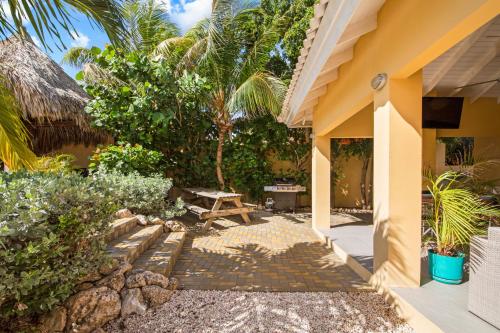 a patio of a house with a picnic table at Villa Rubio in Grote Berg