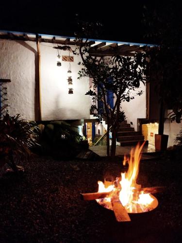 a fire in a yard in front of a building at Patio Chic in Jericó