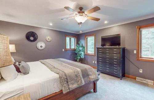 a bedroom with a bed and a ceiling fan at Lilly Pad Landing in Hazelhurst