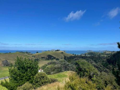 a view of the ocean from the hills at The Woolshed, Papa Aroha, Coromandel in Moturua Island