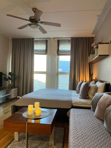 a living room with two beds and a couch at Charming flat next to Old Town and Harbor in Tallinn