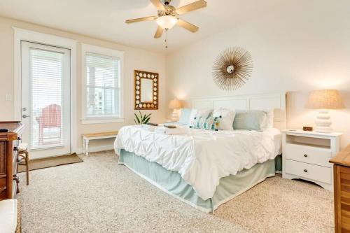 a bedroom with a large bed and a ceiling fan at Open Airy Beautiful - Ocean AND Bay Views! in Galveston