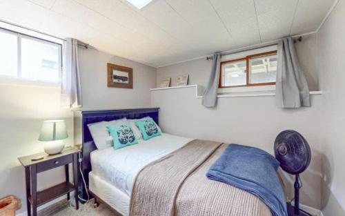 a small bedroom with a bed and a window at Lilly Pad Landing in Hazelhurst