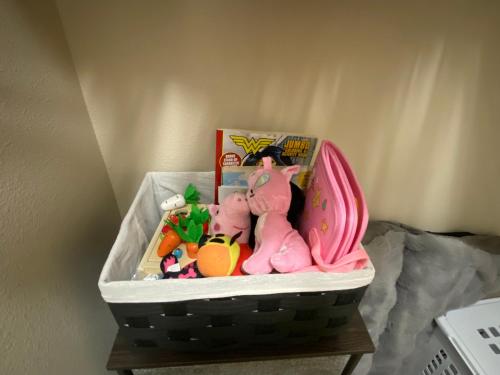 a basket with toys in it on a table at Family friendly 3 story townhouse with workspace in Beaverton