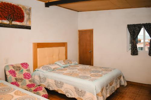 Postel nebo postele na pokoji v ubytování CABAÑA tipo habitación planta alta en Zacatlàn