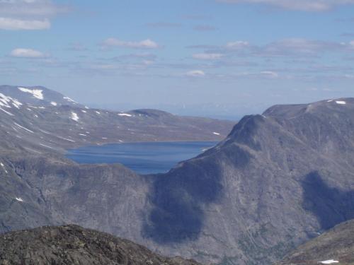 a lake in the middle of a mountain range at Sjodalen Hyttetun og Camping in Stuttgongfossen