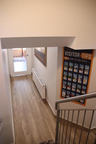 a view from the top of a stairwell of a building at Birdies Townhouse Mitchelstown in Mitchelstown
