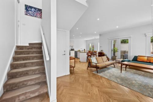 two views of a living room and a dining room at Willos' in Queenscliff