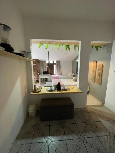 a view of a kitchen and a living room at Residencial Temporada Aracaju in Aracaju