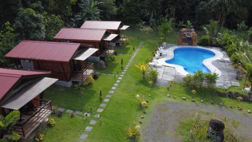 an aerial view of a resort with a swimming pool at Hotel Brisas del Rio Guápiles in Jiménez