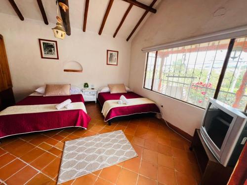 Katil atau katil-katil dalam bilik di El Oasis de la villa