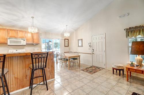 a kitchen and dining room with a table and chairs at Seashell Memories in Rockport