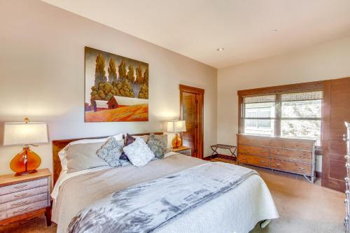 a bedroom with a bed and a painting on the wall at Golf Getaway with Hot Tub, Course Views in Cle Elum! in Cle Elum
