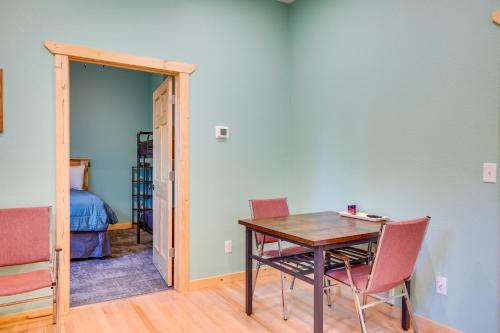 a dining room with a table and chairs and a bedroom at 5 Mi to Twin Lakes State Park Renovated Church! in Toivola