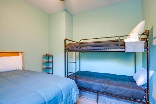 a bedroom with two bunk beds in a room at 5 Mi to Twin Lakes State Park Renovated Church! in Toivola