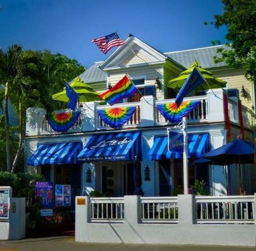 a building with colorful kites hanging from it at La Te Da - Adult Only, 21 or older in Key West