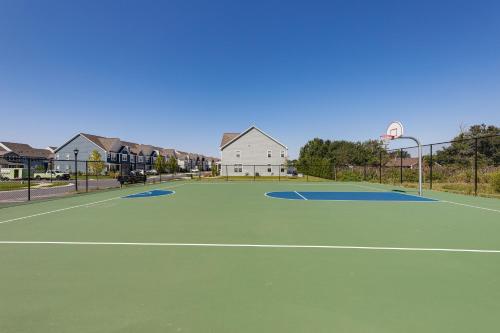 a tennis court with a basketball hoop at 5 Mi to Bethany Beach Resort-Style Gem with Pools! in Ocean View