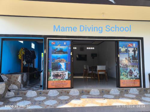 a name of a nursing school with a sign in the window at Mango Moon in Pemuteran