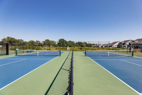 two tennis courts on a tennis court at 5 Mi to Bethany Beach Resort-Style Gem with Pools! in Ocean View