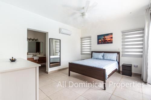 Giường trong phòng chung tại Villa 24, Ocean Village, Sosua!