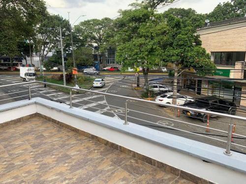 a view of a parking lot with cars on a street at Apartamento en ciudad jardín #7 in Cali