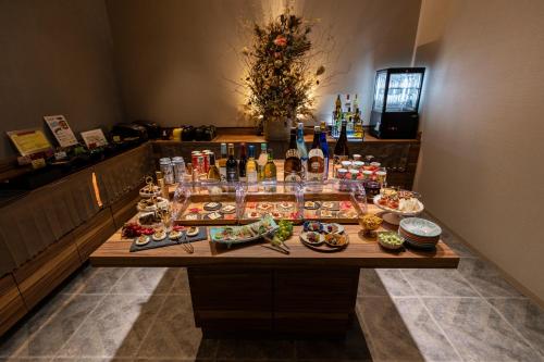 a buffet of food on a table in a room at Hiyori Hotel Osaka Namba Station in Osaka