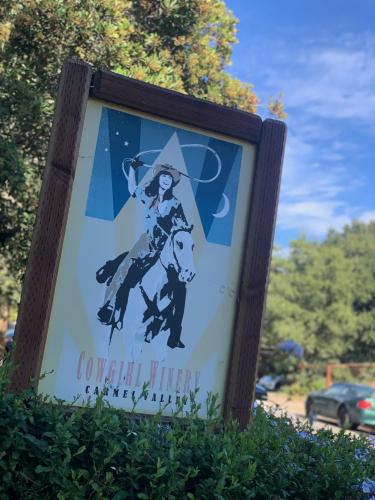 a sign with a woman riding a horse at Contenta Inn in Carmel Valley