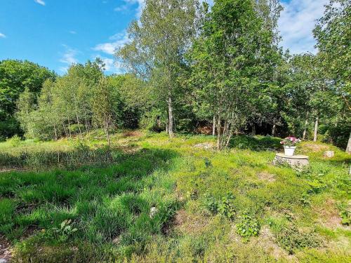 a field with a vase in the middle of it at 8 person holiday home in ELLÖS in Ellos