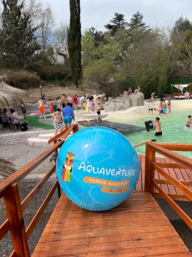 a blue frisbee sitting on top of a wooden deck at Hotel Terrazas by CPH in Villa Carlos Paz