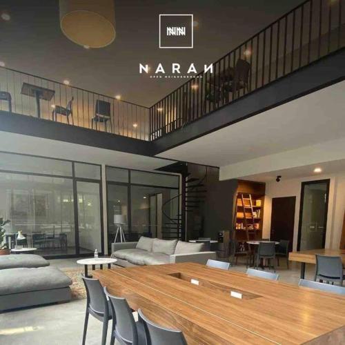 a living room with a wooden table and chairs at Amazing Loft Plaza Mayor Zone AC Wifi CoWorking in Miravalle