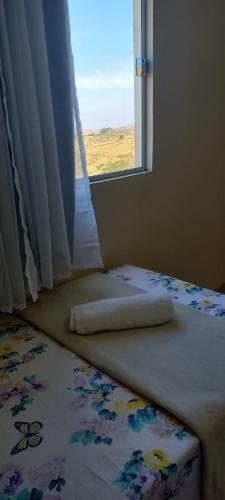 Un ou plusieurs lits dans un hébergement de l'établissement Flat do Sossego 2