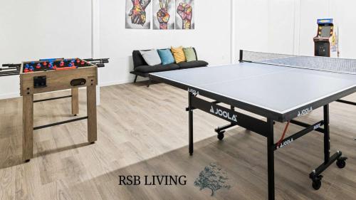 a ping pong table in a living room with a ping pong tableablish at Newly Renovated 6BR 3BA Port Arthur Holiday Home with Hot Tub in Port Arthur