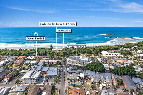 an aerial view of a city and the beach at Sawtell Beach Ocean Sands 3 - Opposite Main Beach and short stroll to Coffee Shops and Restaurants! in Sawtell