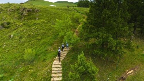 a group of people walking up a hill at Tuul Riverside Lodge in Gatsuurt