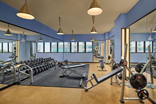 a gym with a lot of treadmills and machines at Novotel Nha Trang in Nha Trang