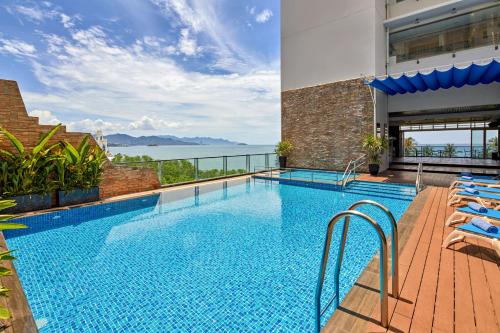 a swimming pool with a view of the water at Novotel Nha Trang in Nha Trang