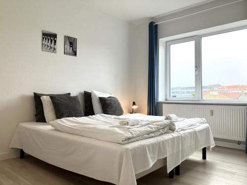 Postel nebo postele na pokoji v ubytování One-Bedroom Apartment Located In The Charming City Of Kolding