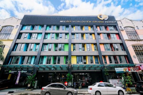 two cars parked in front of a building at Kingston Hotel 2 - Setapak in Kuala Lumpur