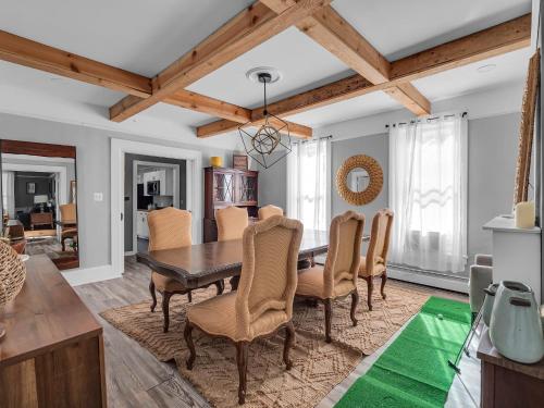 a dining room with a table and chairs at The Kelly House - 4 BR Historic Lodge - Downtown in Ellicottville