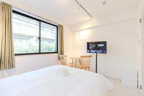 Katil atau katil-katil dalam bilik di Calm Riverside Inn Close to Ikebukuro