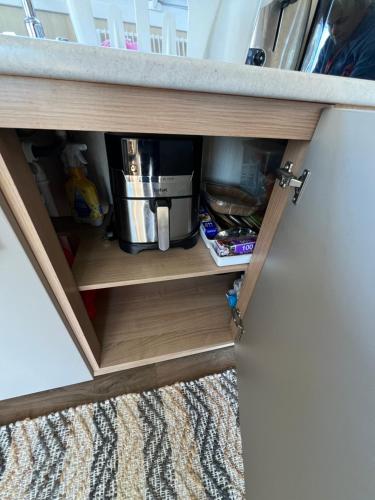 a cabinet with a counter top in a room at Flower Bay in Prestatyn