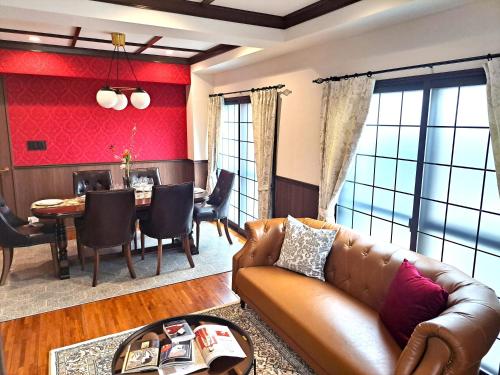 a living room with a couch and a table at IROHA STAY HANEDA - Family-Friendly Home Stay near Haneda with Great Access to Tokyo & Yokohama in Tokyo