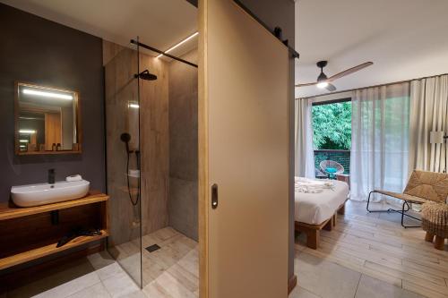 Cama o camas de una habitación en Papangue Hôtel & Spa